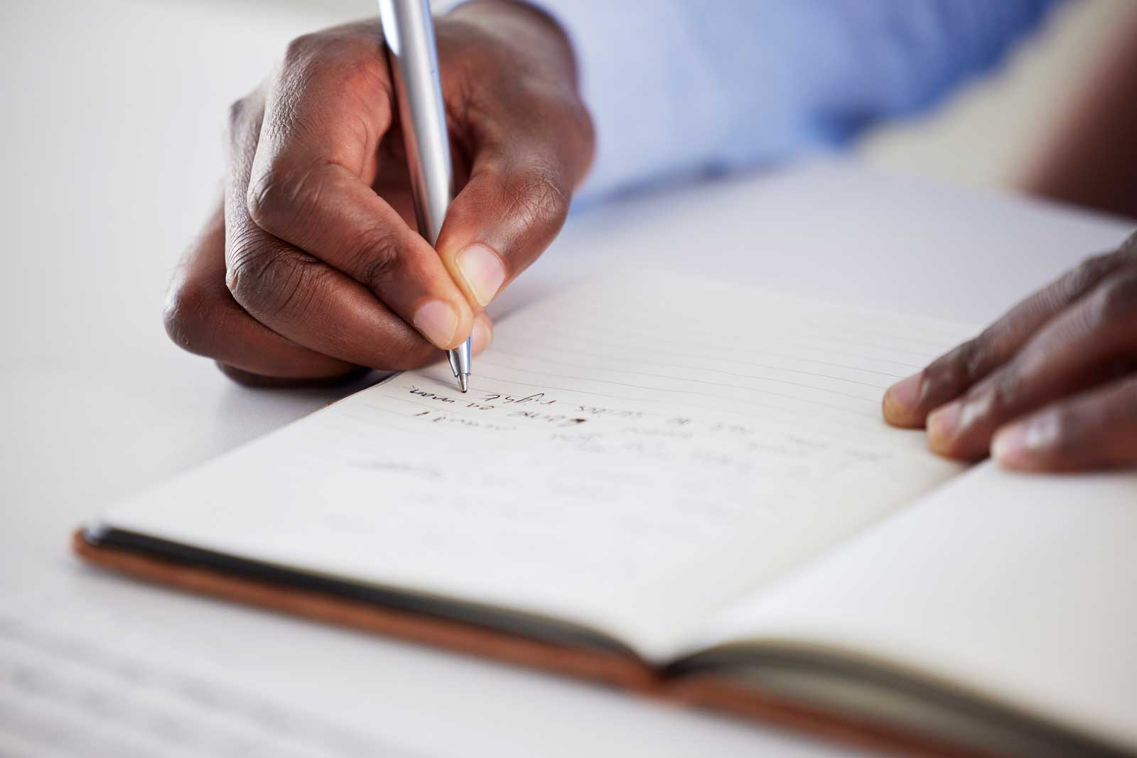 closeup-of-one-african-american-businessman-writin-2023-11-27-05-24-03-utc